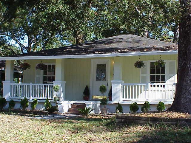 1259 Cook Jacksonville, FL 32205 - Photo 2 of 2 a front view of a house with a yard table and chairs