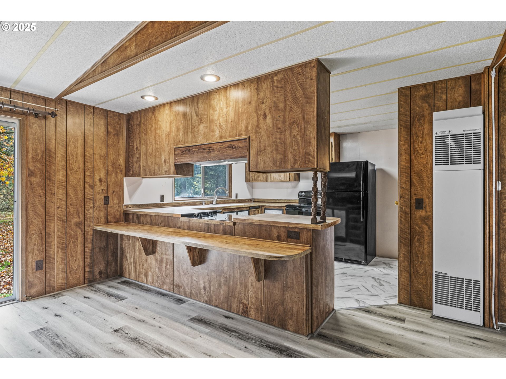 2032 Southeast 283rd Avenue Camas, WA 98607 - Photo 4 of 22 a kitchen with kitchen island granite countertop a sink stove and refrigerator
