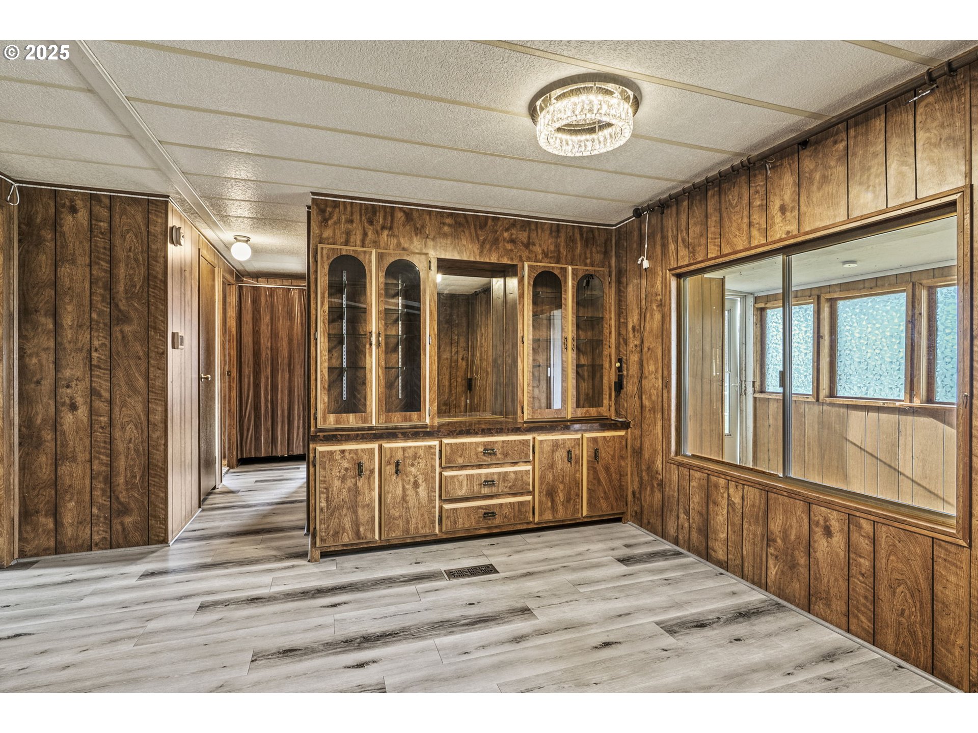 2032 Southeast 283rd Avenue Camas, WA 98607 - Photo 10 of 22 a view of an empty room with wooden floor and a window
