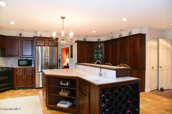a living room with dining table and a large window