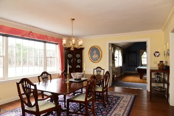 a living room with furniture a fireplace and city view
