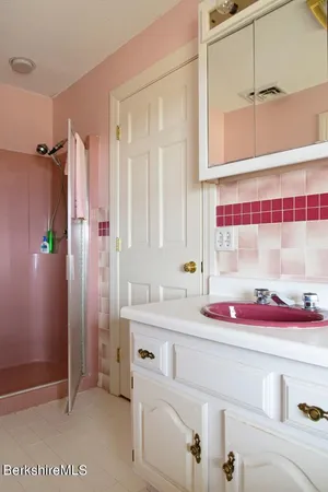 a picture of a bathroom with a sink