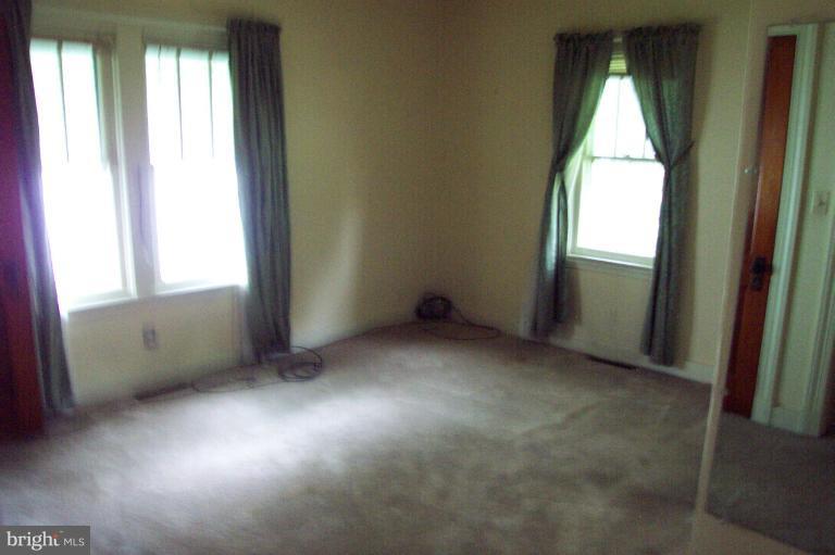 103 Rambler Road Cambridge, MD 21613 - Photo 17 of 19 Bedroom 2 is spacious w/steps to attic