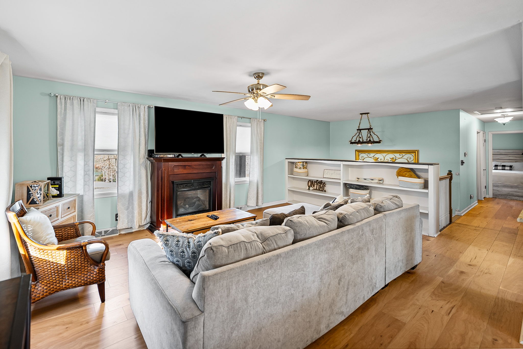 148 Green Hill Drive Grand Rivers, KY 42045 - Photo 11 of 65 a living room with furniture a flat screen tv and a fireplace