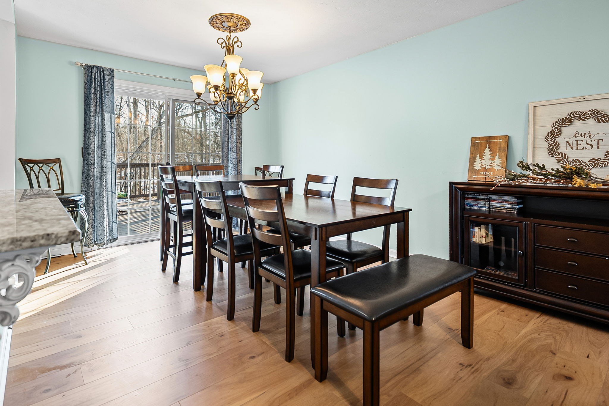 148 Green Hill Drive Grand Rivers, KY 42045 - Photo 15 of 65 a view of a dining room with furniture a chandelier and wooden floor