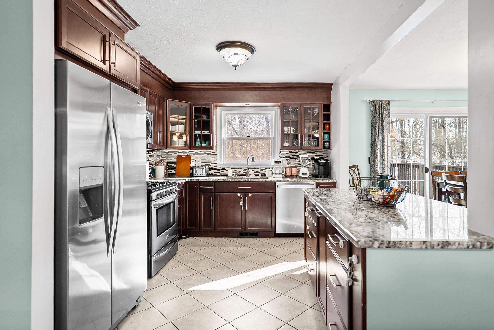 148 Green Hill Drive Grand Rivers, KY 42045 - Photo 17 of 65 a kitchen with stainless steel appliances granite countertop a refrigerator and a stove