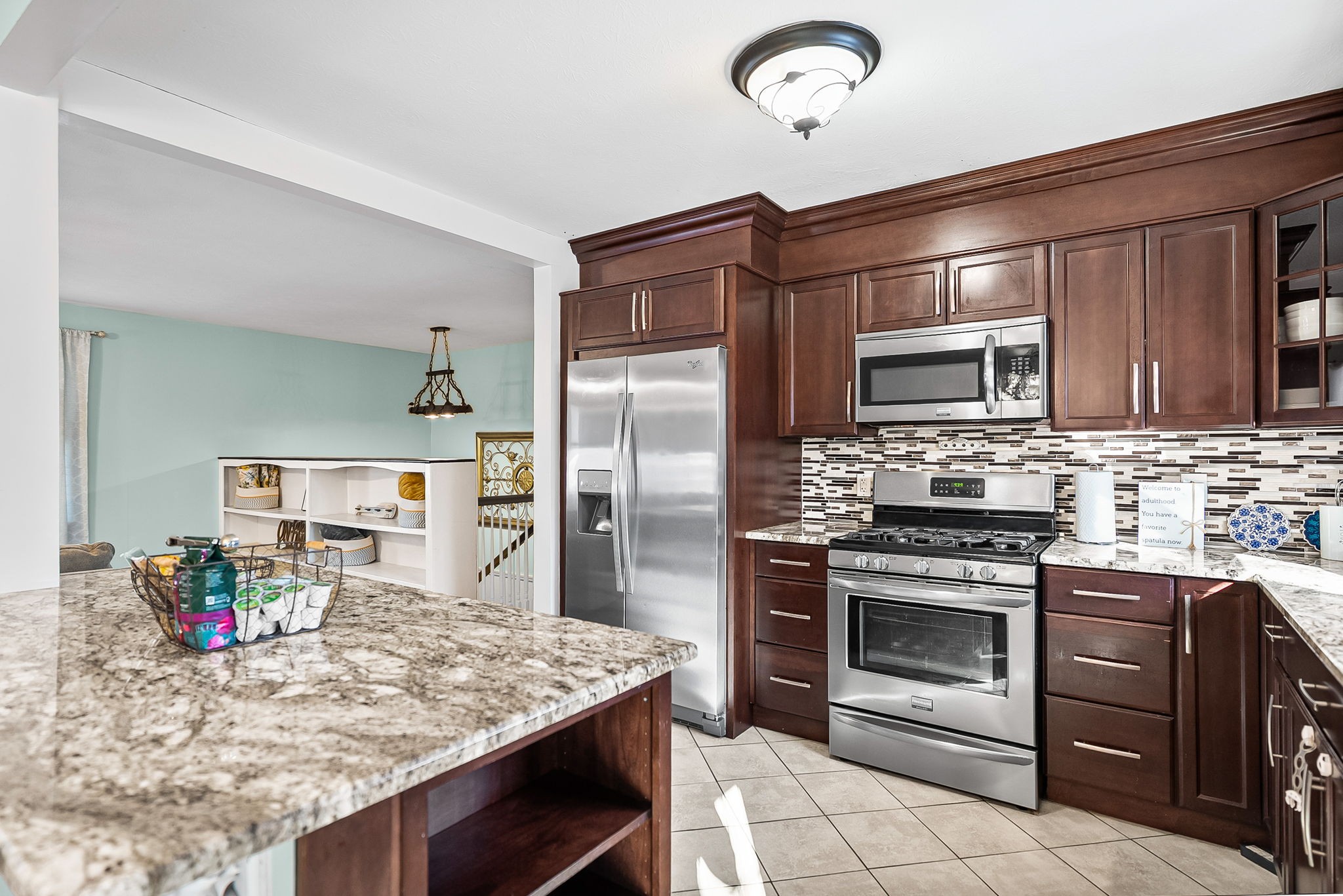 148 Green Hill Drive Grand Rivers, KY 42045 - Photo 18 of 65 a kitchen with stainless steel appliances granite countertop a stove refrigerator and microwave