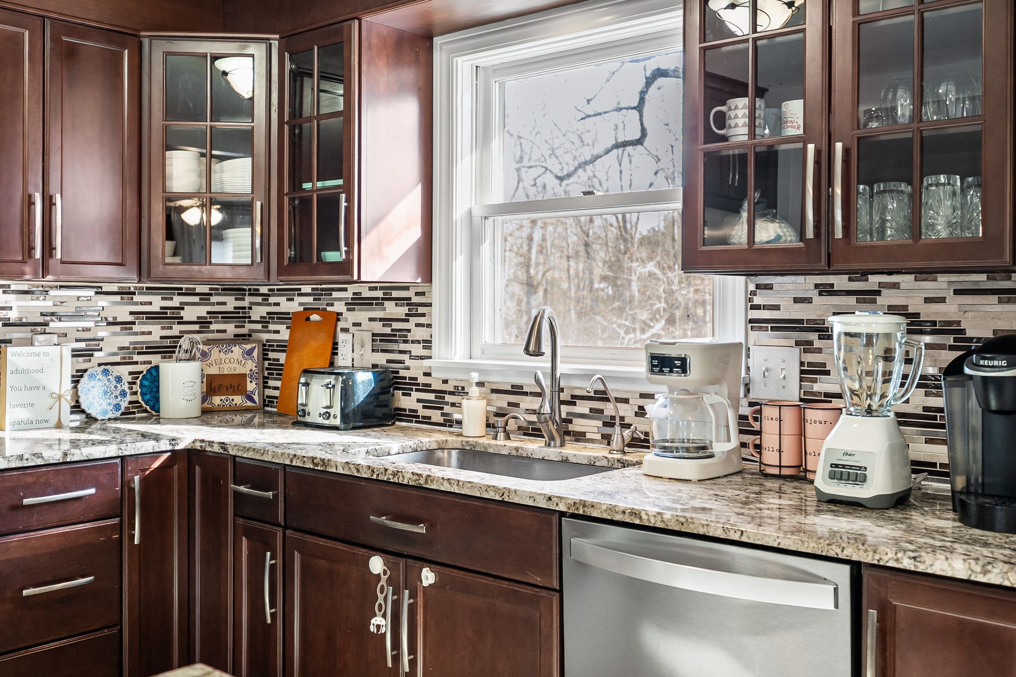 148 Green Hill Drive Grand Rivers, KY 42045 - Photo 19 of 65 a kitchen with granite countertop stainless steel appliances a sink and a window