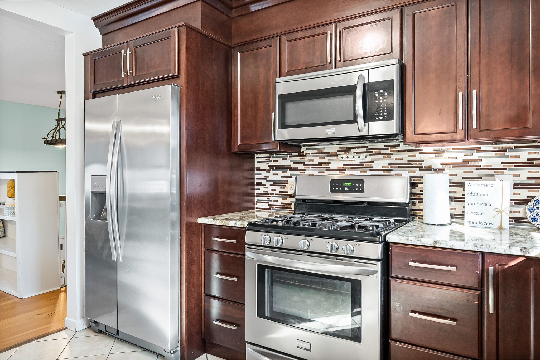 148 Green Hill Drive Grand Rivers, KY 42045 - Photo 20 of 65 a kitchen with granite countertop a stove microwave and refrigerator