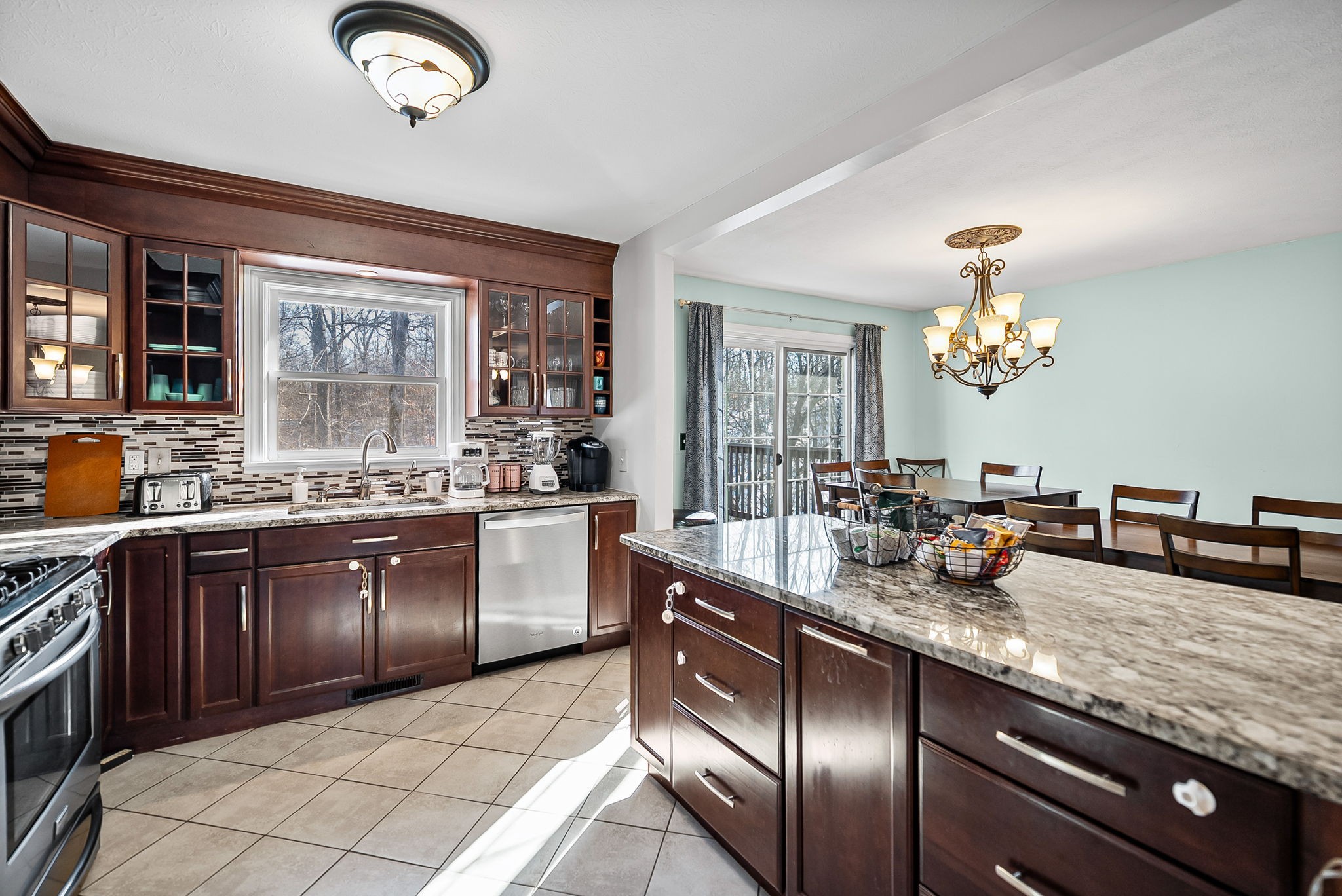 148 Green Hill Drive Grand Rivers, KY 42045 - Photo 21 of 65 a kitchen with stainless steel appliances granite countertop a sink dishwasher stove and oven