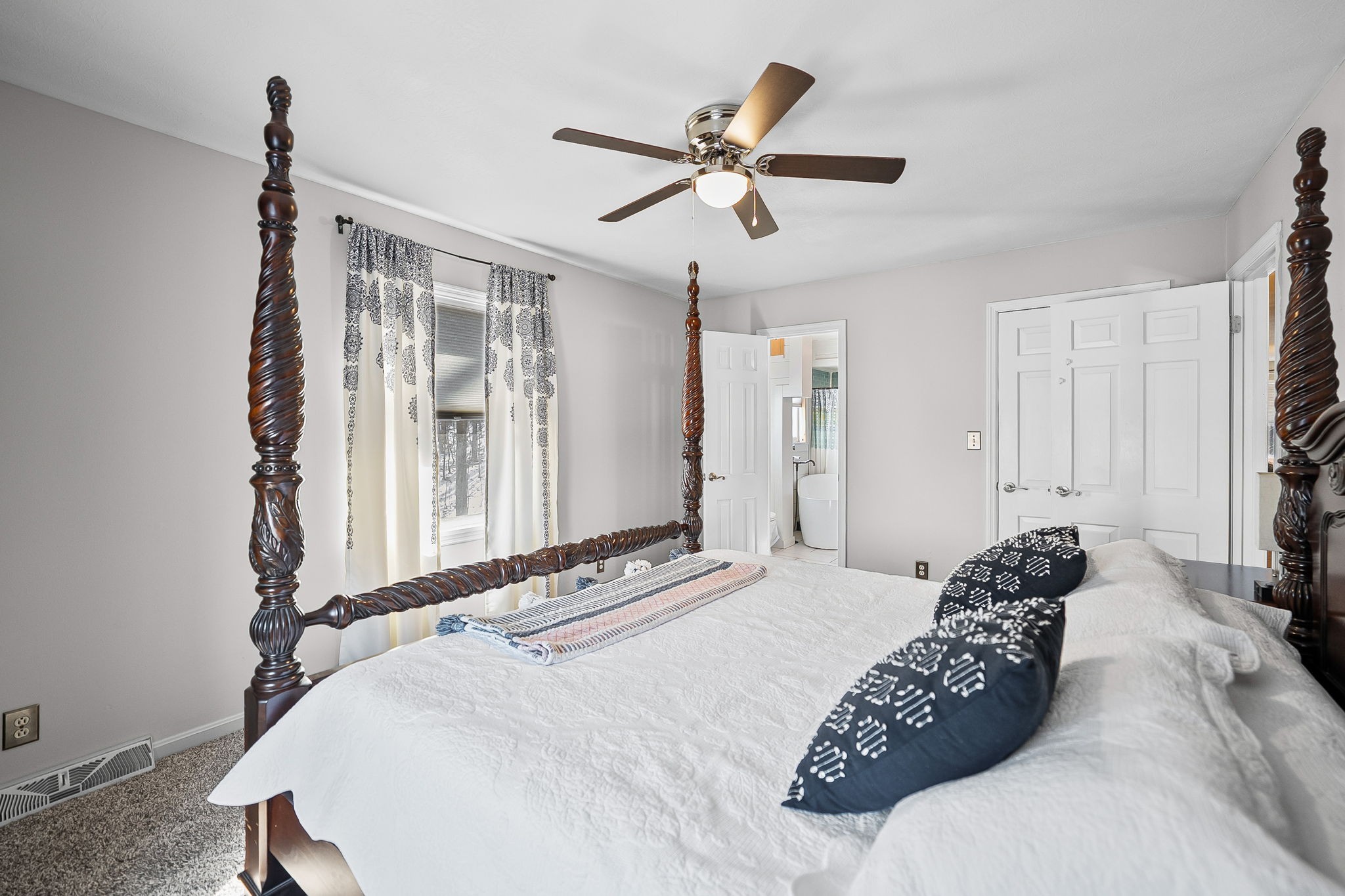 148 Green Hill Drive Grand Rivers, KY 42045 - Photo 23 of 65 a bedroom with a bed and a chandelier