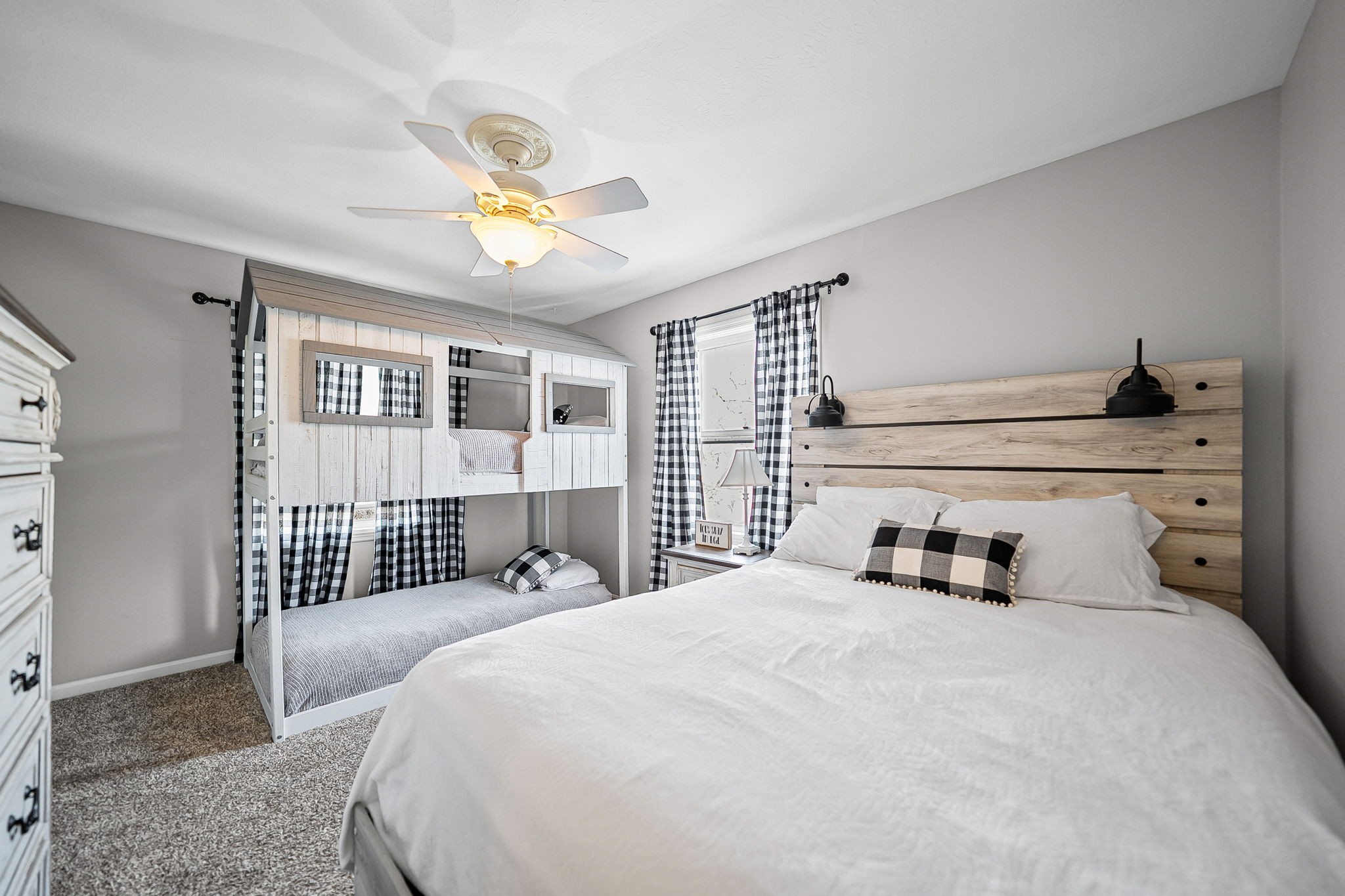 148 Green Hill Drive Grand Rivers, KY 42045 - Photo 27 of 65 a bedroom with a bed and a chandelier