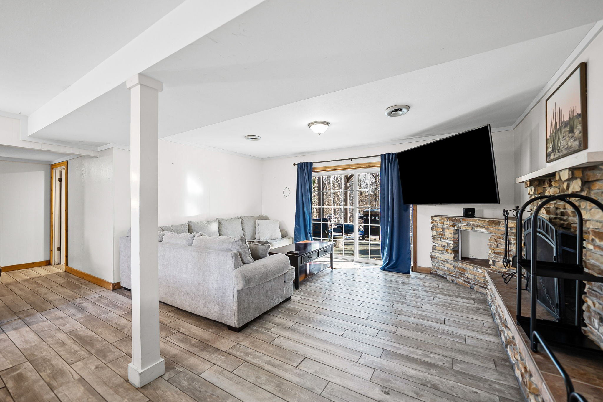 148 Green Hill Drive Grand Rivers, KY 42045 - Photo 34 of 65 a living room with furniture and a flat screen tv