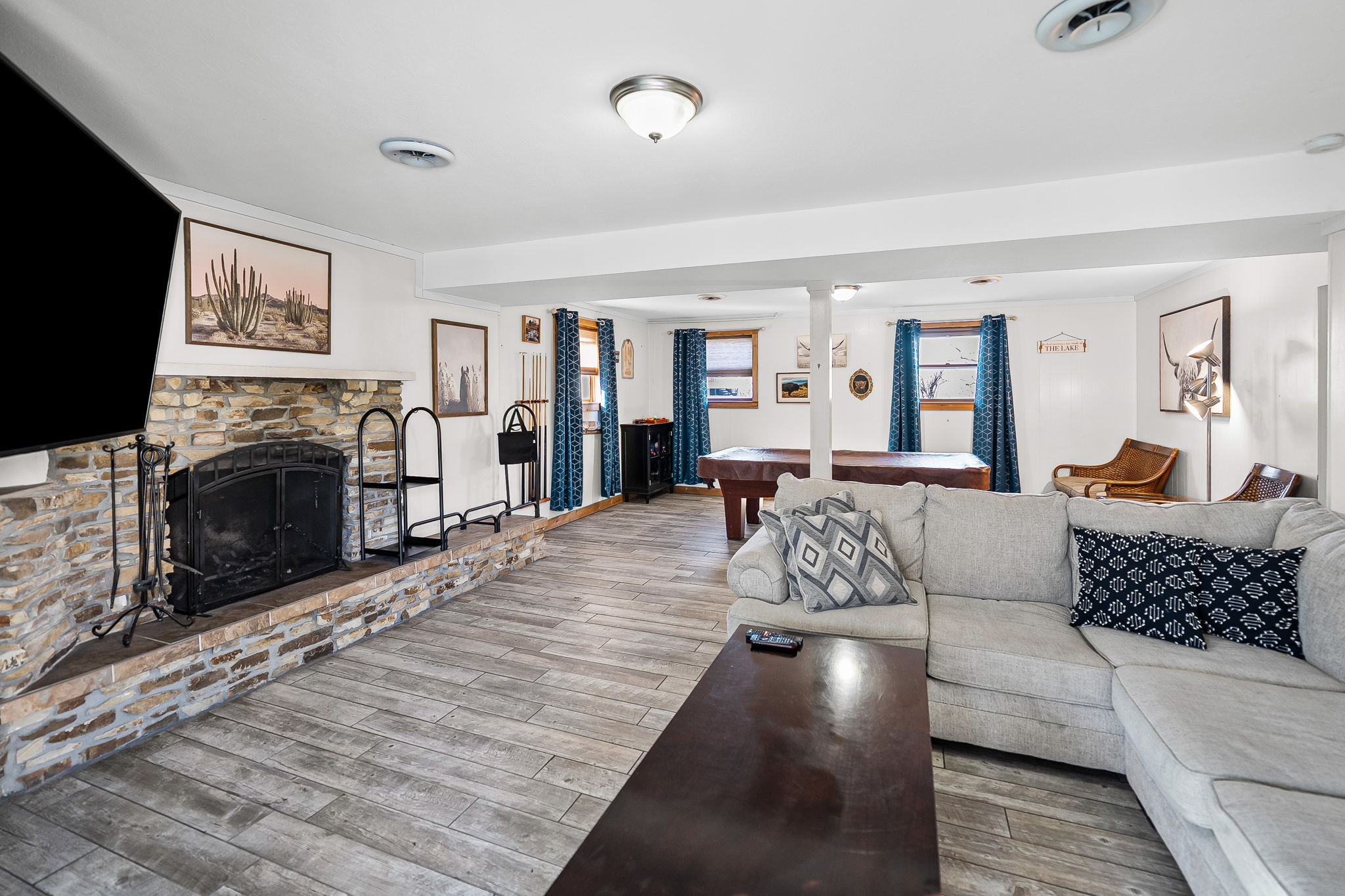 148 Green Hill Drive Grand Rivers, KY 42045 - Photo 37 of 65 a living room with furniture and a fireplace or television