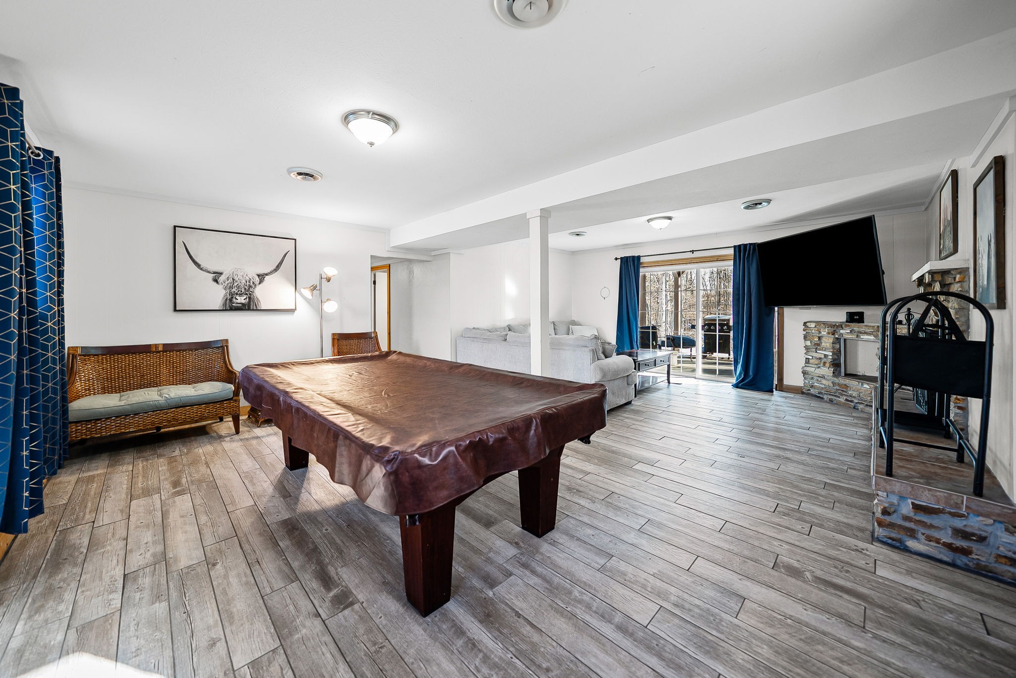 148 Green Hill Drive Grand Rivers, KY 42045 - Photo 39 of 65 a living room with a table chairs and a wooden floor