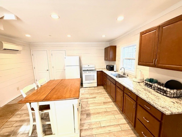 148 Green Hill Drive Grand Rivers, KY 42045 - Photo 58 of 65 a large kitchen with kitchen island a sink stove and wooden cabinets