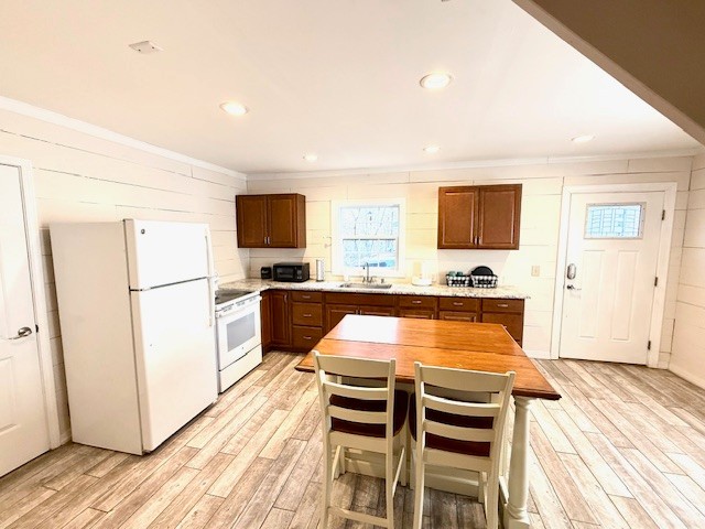 148 Green Hill Drive Grand Rivers, KY 42045 - Photo 59 of 65 a kitchen with granite countertop a refrigerator and a sink