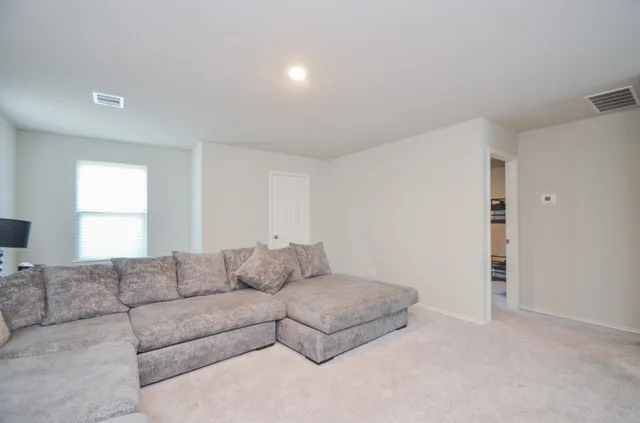 a bedroom with a bed and a cabinets