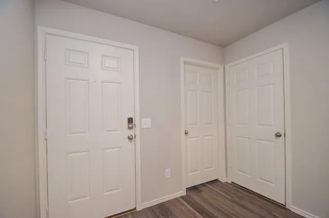 a view of a livingroom with wooden floor