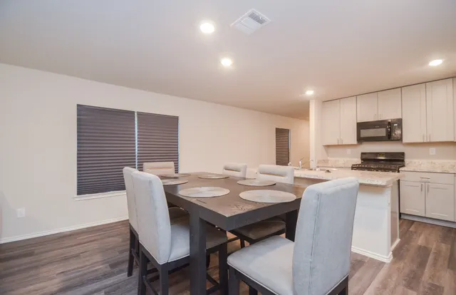 a view of a dining room with furniture