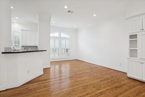 a kitchen with sink and cabinets
