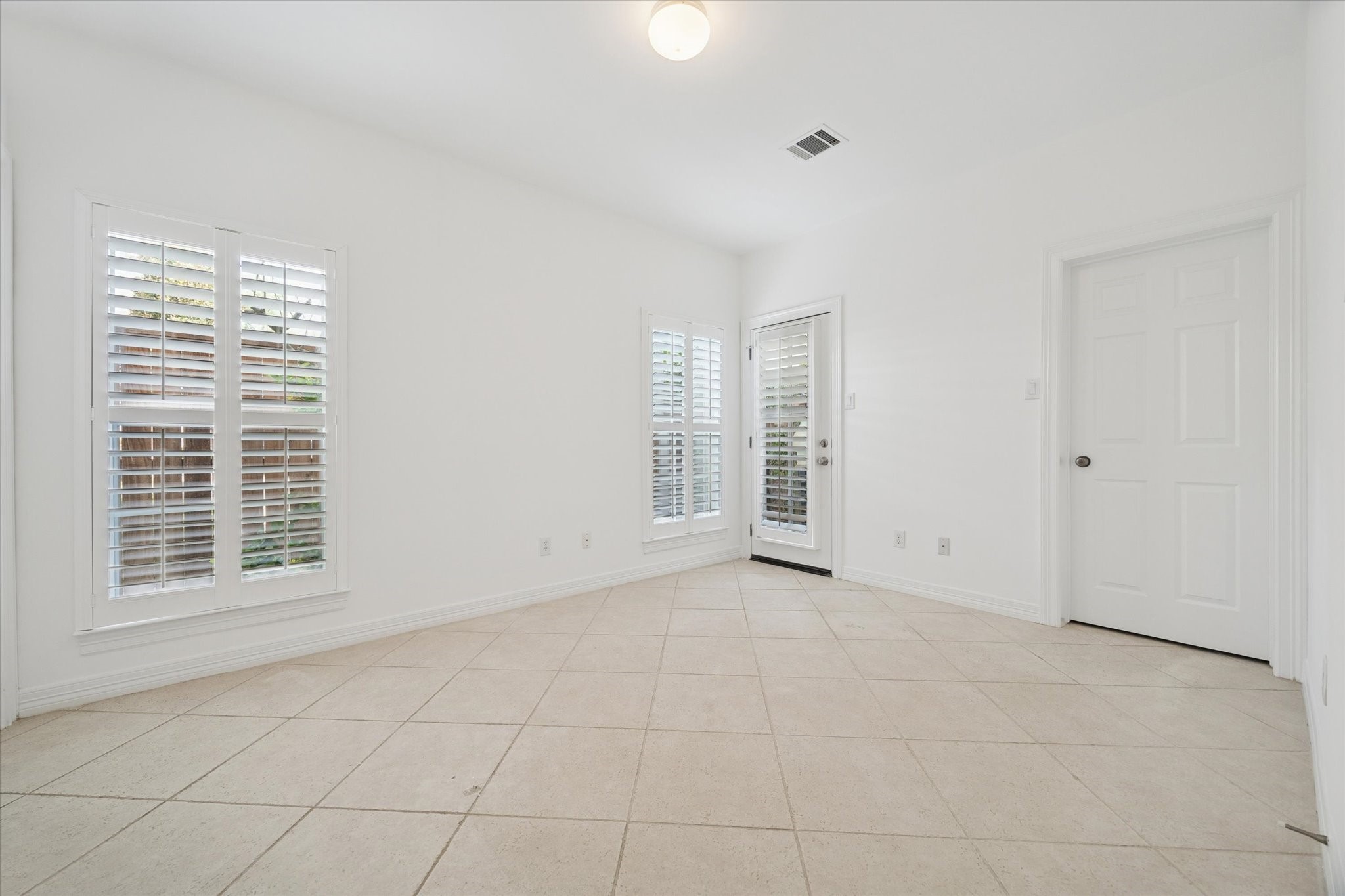 2638 Wroxton Road West University Place, TX 77005 - Photo 5 of 31 There is a door out to a small back area perfect for small pets, etc.