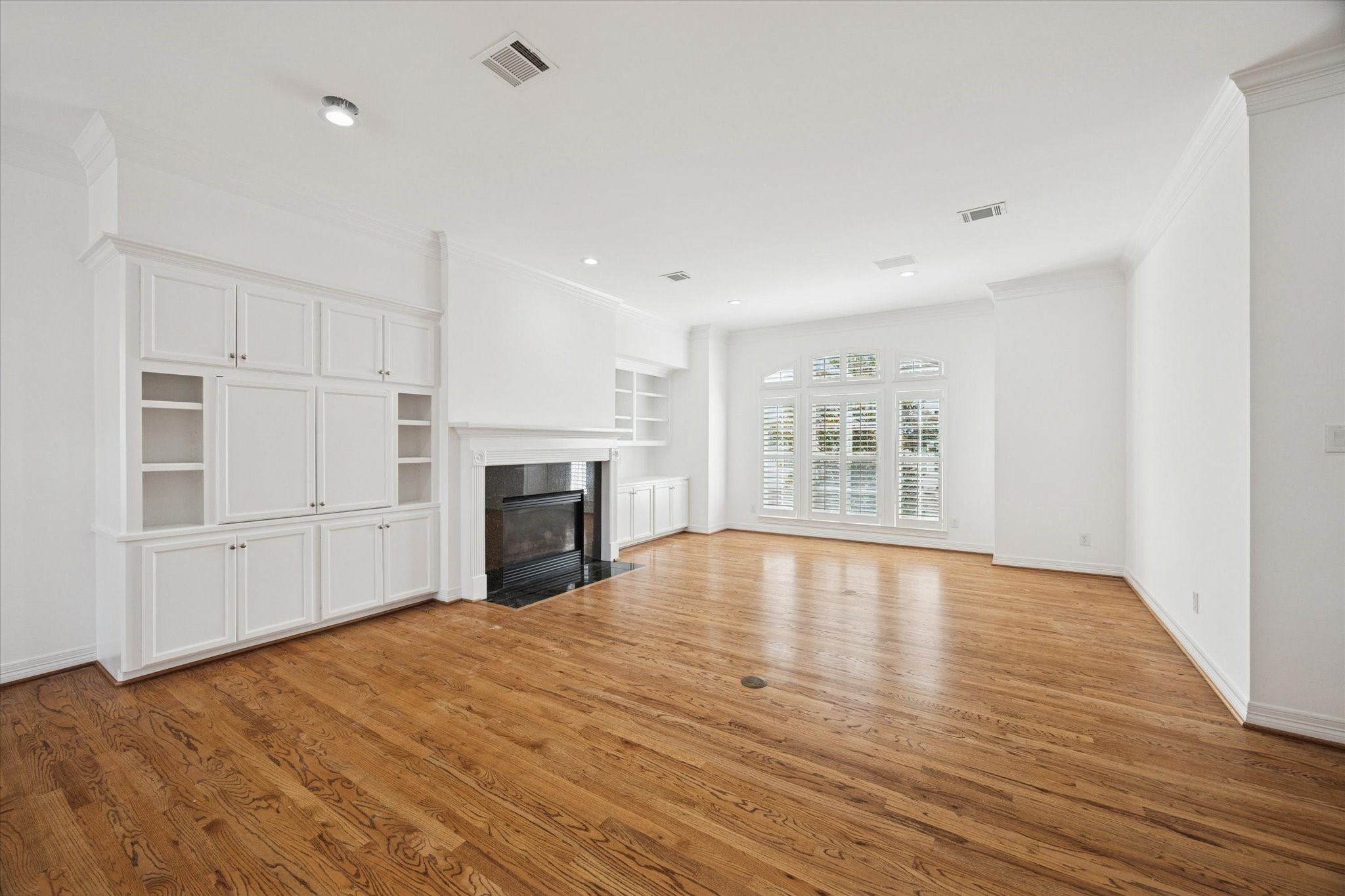 2638 Wroxton Road West University Place, TX 77005 - Photo 10 of 31 This view of the room without furniture shows the gleaming hardwood floors and crown molding