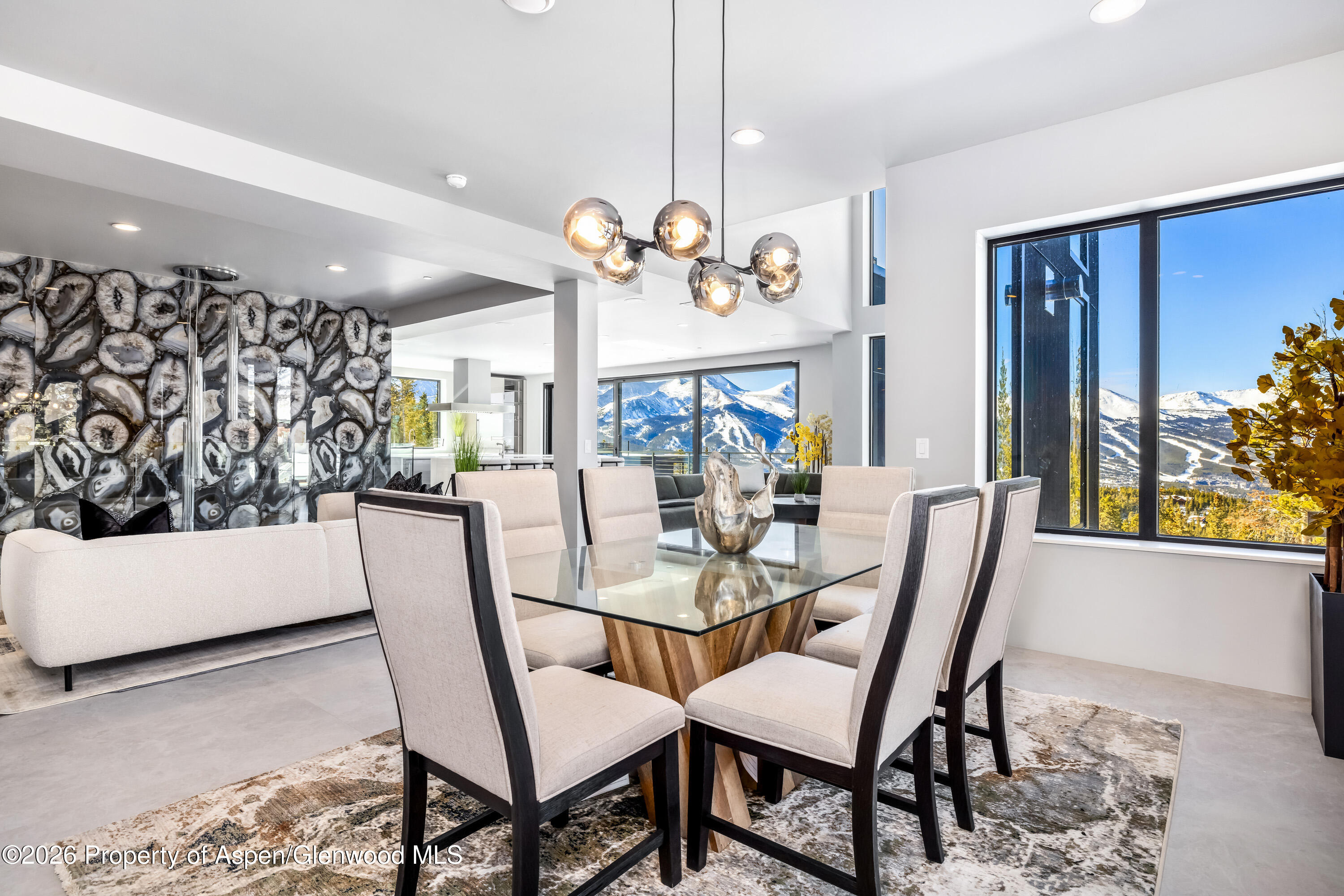 316 Fuller Placer Road Breckenridge, CO 80424 - Photo 21 of 52 a view of a dining room with furniture and a large window
