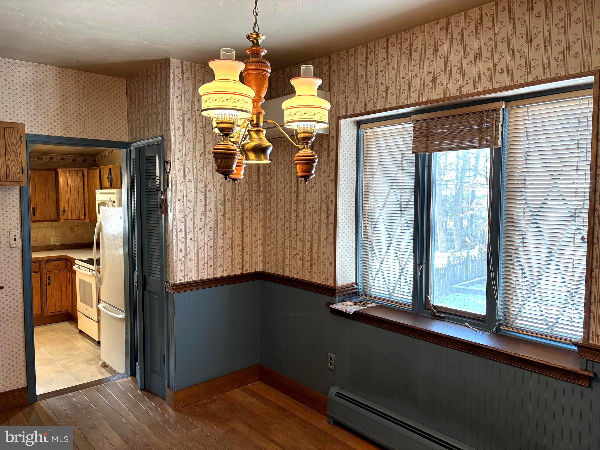 404 North Main Street Red Lion, PA 17356 - Photo 13 of 28 a view of a hallway with wooden floor and windows