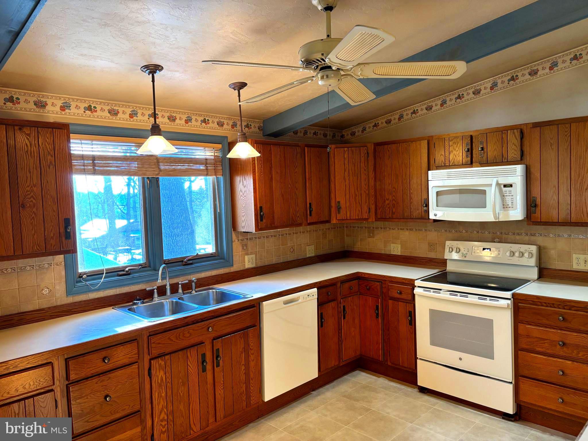 404 North Main Street Red Lion, PA 17356 - Photo 4 of 28 a kitchen with a sink stove and cabinets