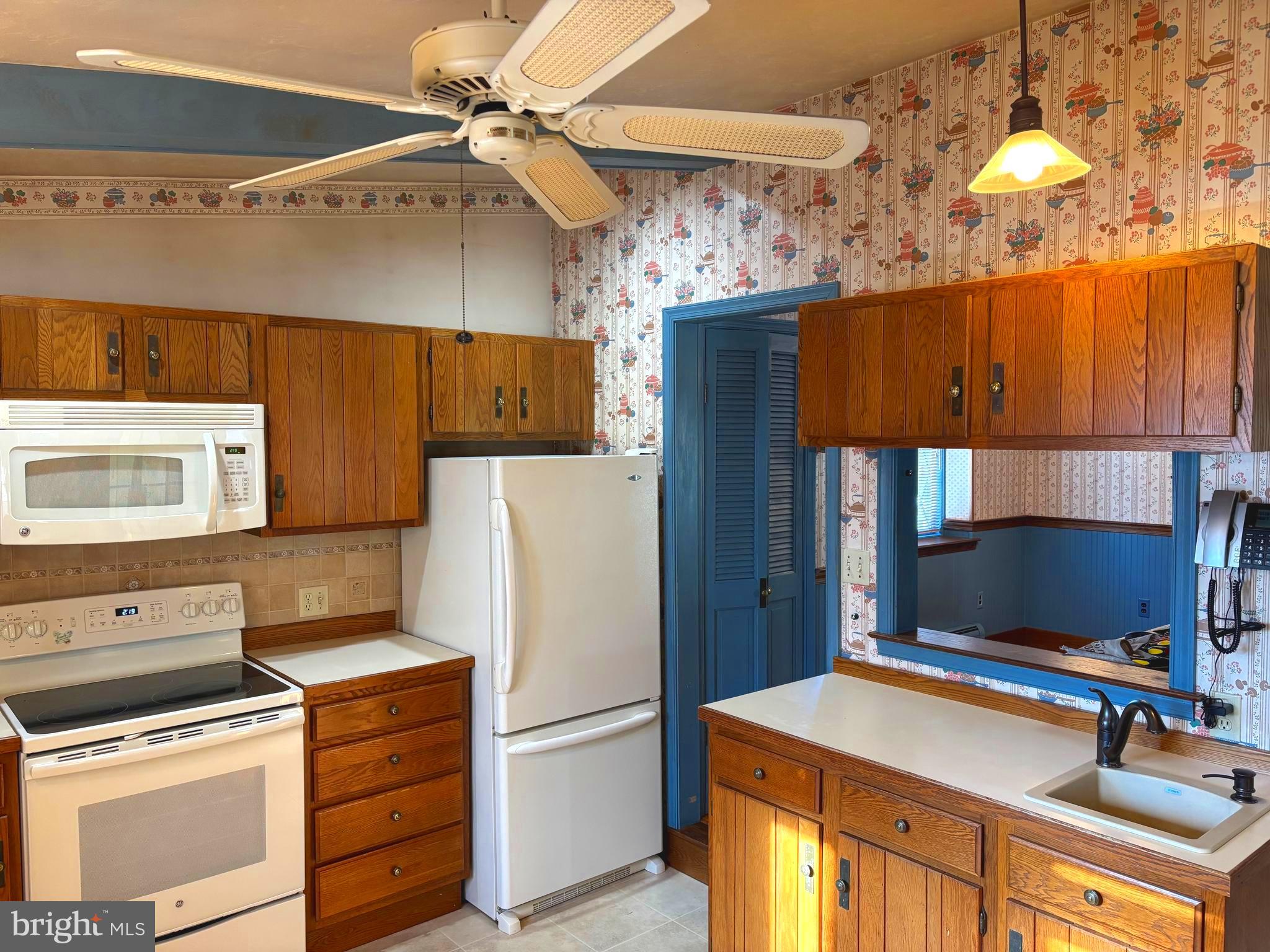 404 North Main Street Red Lion, PA 17356 - Photo 6 of 31 a kitchen with a refrigerator and a stove top oven