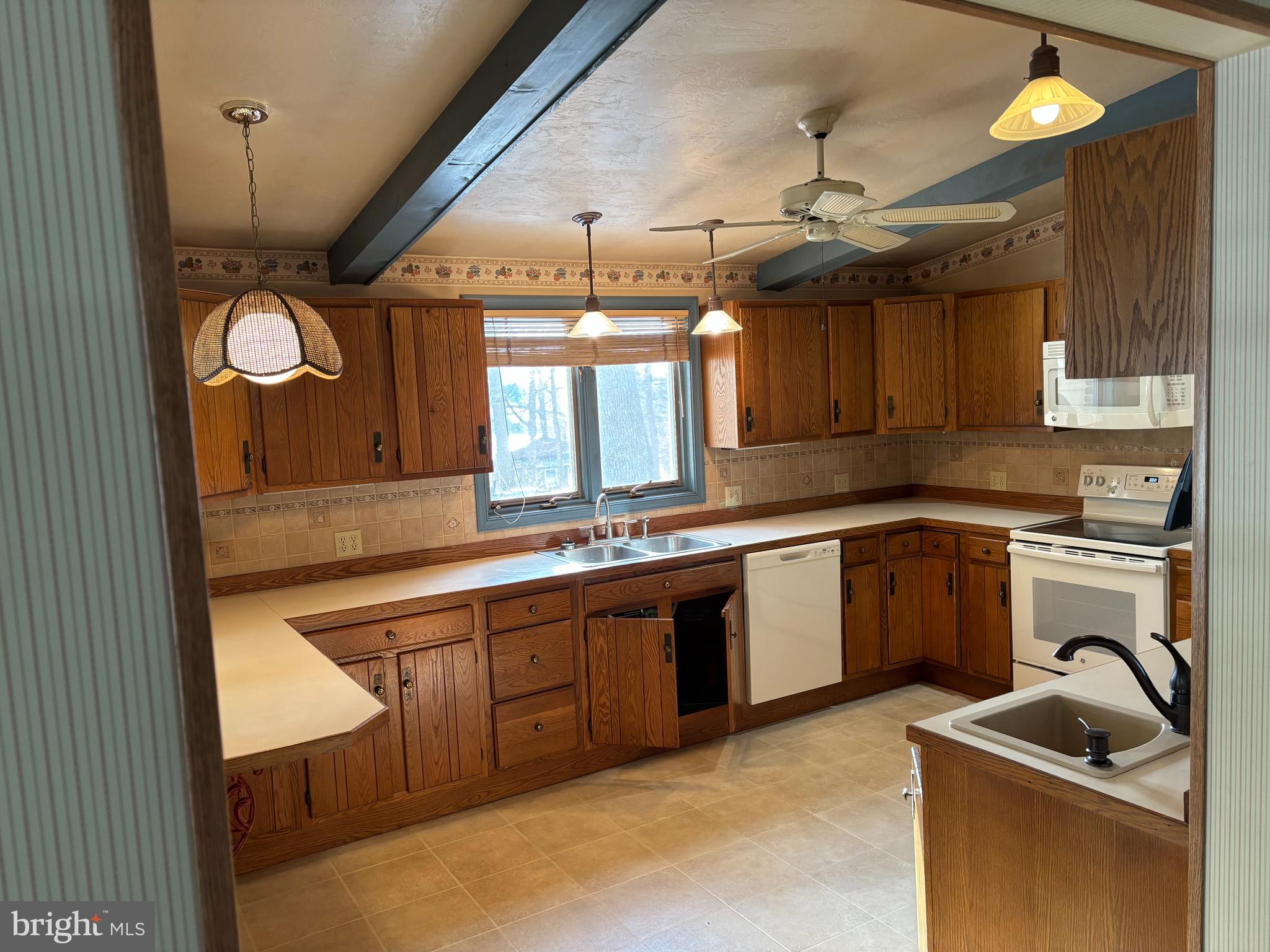 404 North Main Street Red Lion, PA 17356 - Photo 7 of 31 a kitchen with granite countertop a sink and a stove