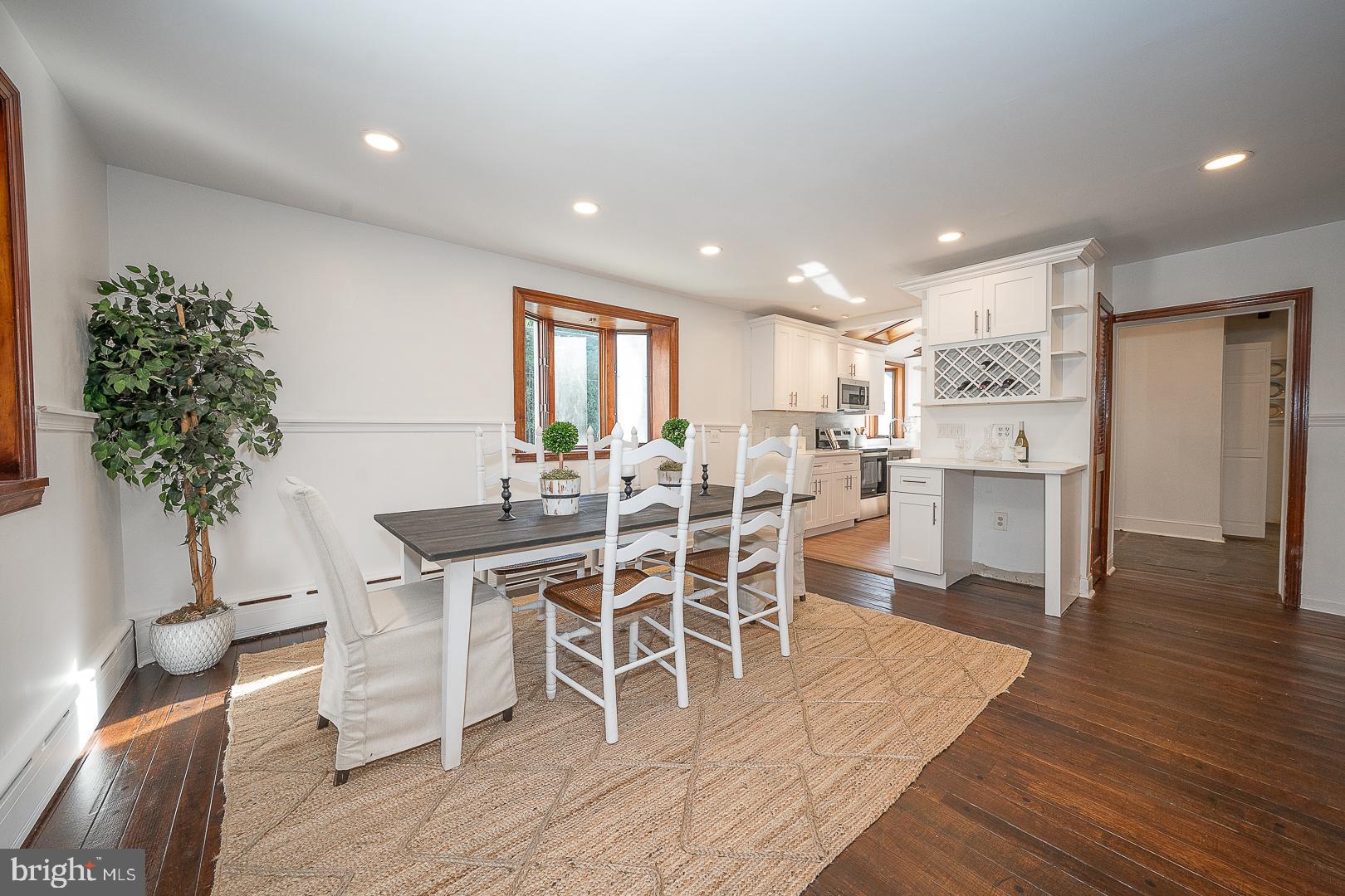 875 Old State Road Berwyn, PA 19312 - Photo 13 of 30 a view of a dining room with furniture and wooden floor