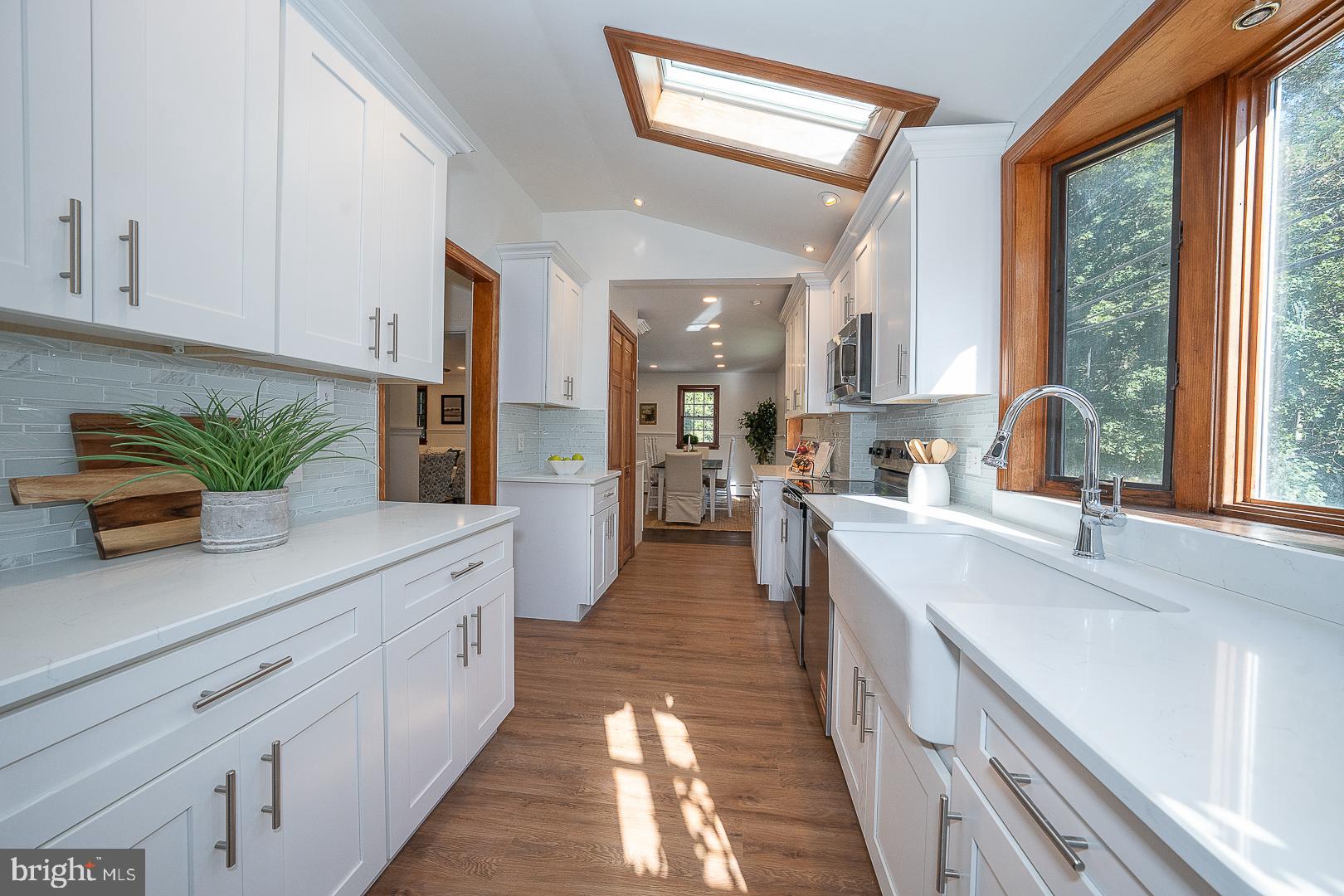 875 Old State Road Berwyn, PA 19312 - Photo 15 of 30 a large kitchen with stainless steel appliances granite countertop a lot of counter space and a sink