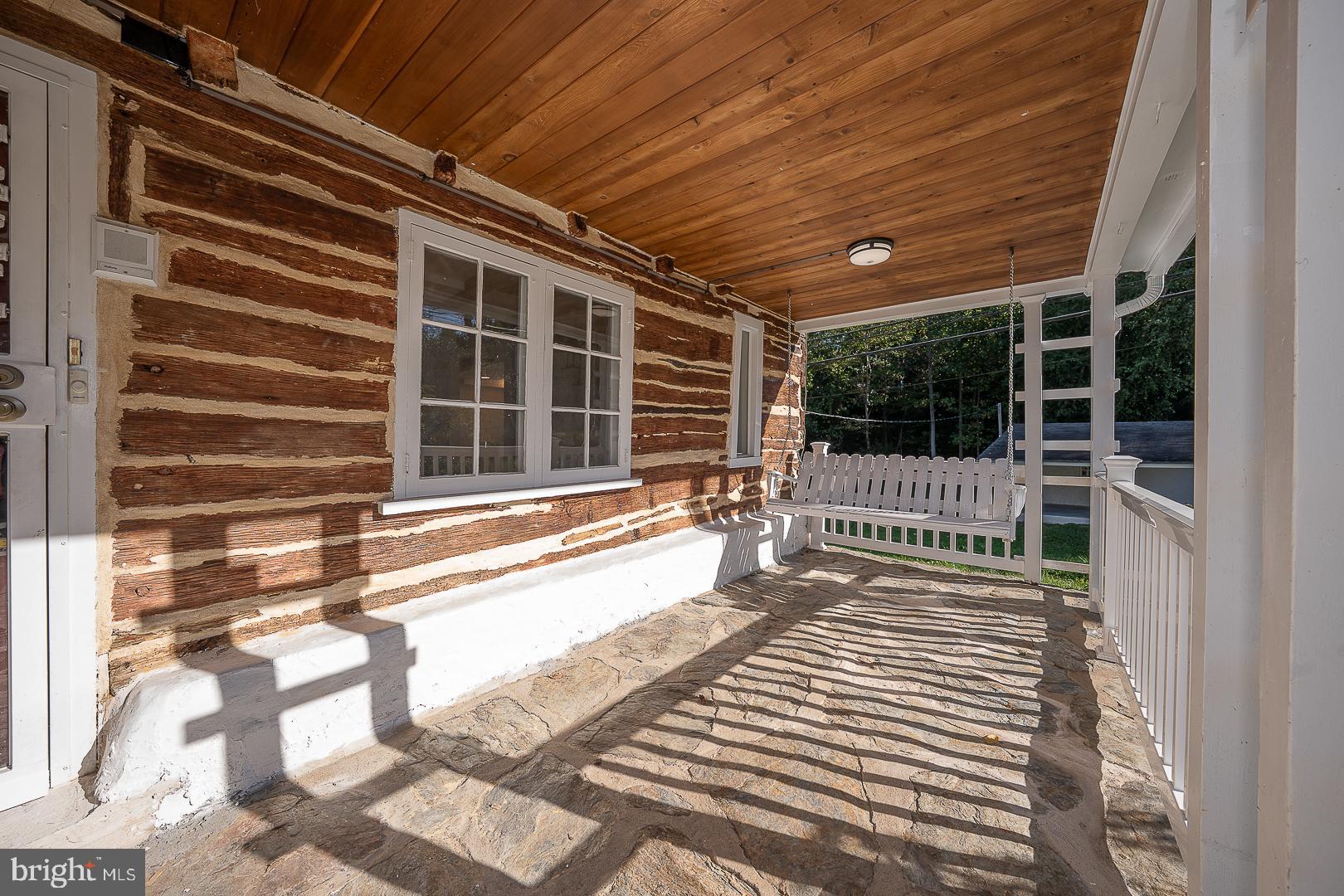 875 Old State Road Berwyn, PA 19312 - Photo 2 of 30 a view of a balcony with a floor to ceiling window and wooden fence