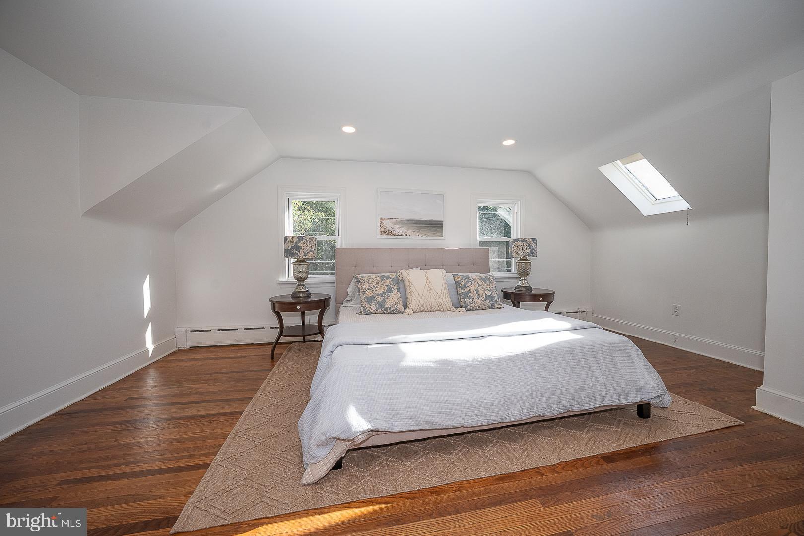 875 Old State Road Berwyn, PA 19312 - Photo 24 of 30 a spacious bedroom with a bed and a table