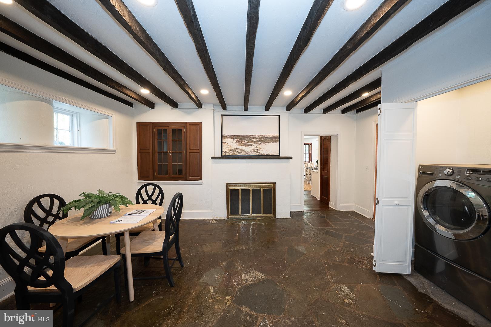 875 Old State Road Berwyn, PA 19312 - Photo 8 of 30 a view of a livingroom with furniture and a fireplace
