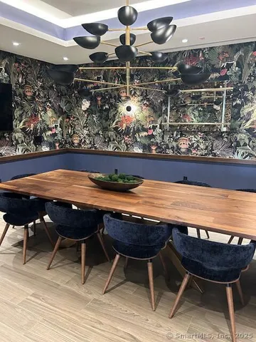 a view of a house with swimming pool and sitting area