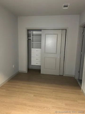 an empty room with a bathroom
