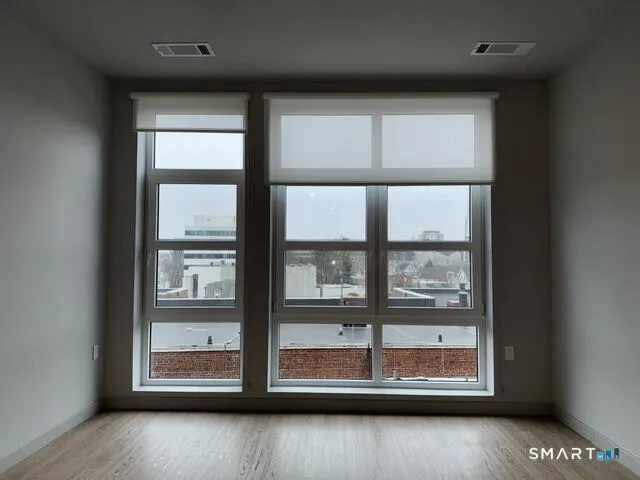 a kitchen with stainless steel appliances a stove a microwave a sink and cabinets