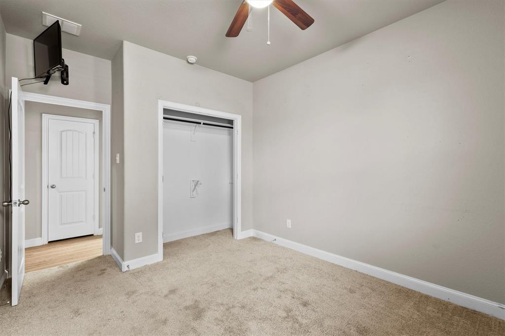 11 Pleasant Valley Sanger, TX 76266 - Photo 16 of 20 an empty room with closet and a chandelier fan