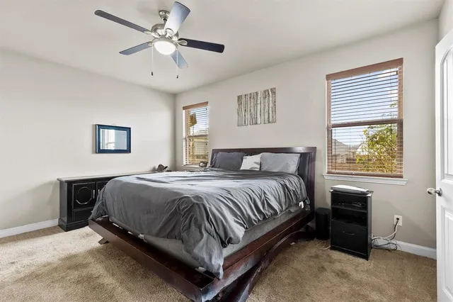 a bedroom with a bed and a table