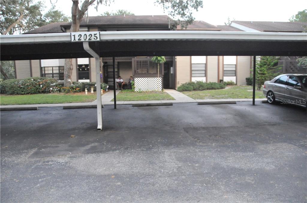 12025 Proctor Loop, Unit 2 New Port Richey, FL 34654 - Photo 1 of 1 a view of a porch and a yard