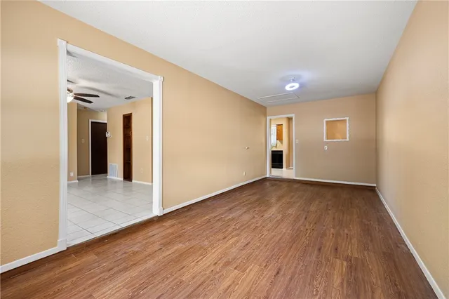 a view of livingroom with hardwood floor and hallway