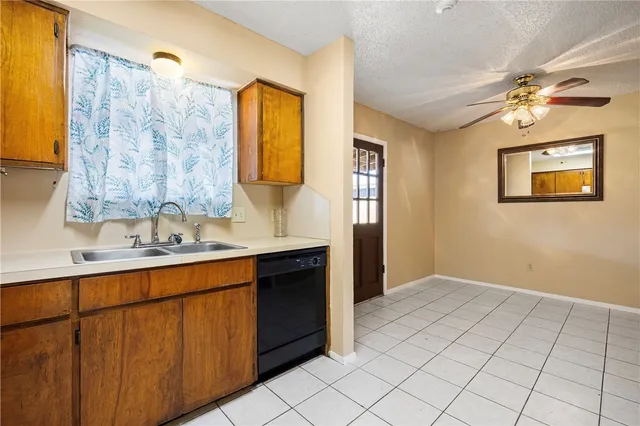 a view of bathroom with a sink mirror and a shower