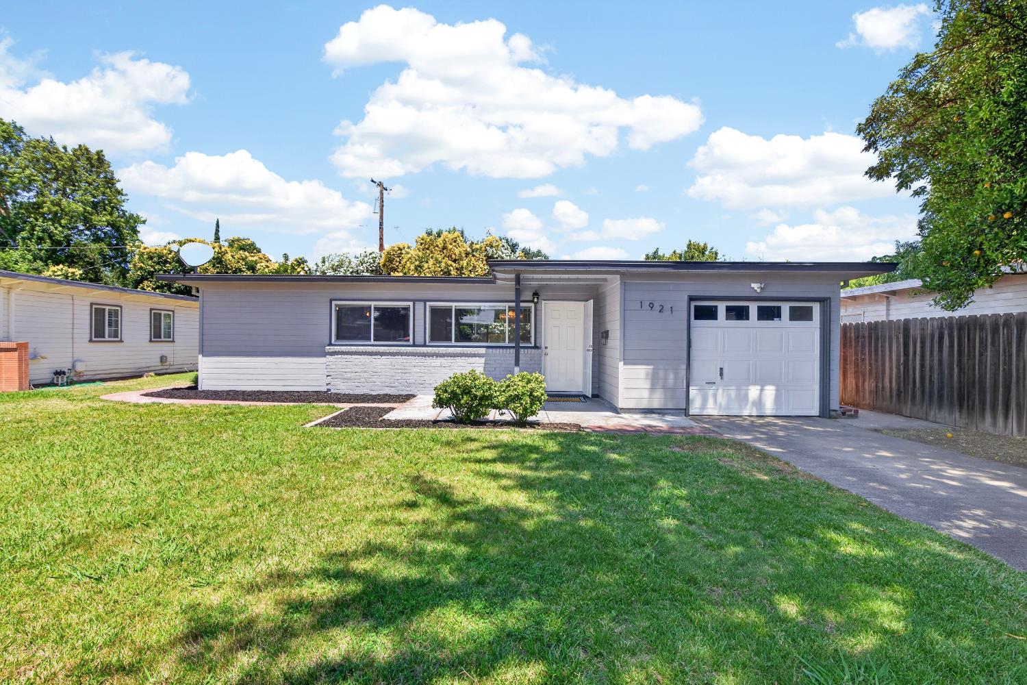 1921 Calhoun Way Stockton, CA 95207 - Photo 2 of 35 Check out the garage panel windows, balances the house windows and boosts curb appeal.