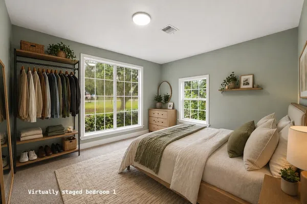 a bedroom with a bed and a couch