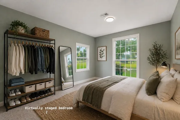 a bedroom with a bed a mirror and a window
