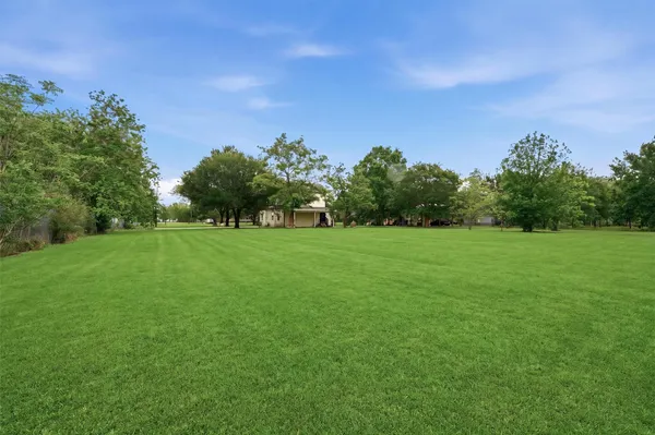 a backyard with a garden and entertaining space