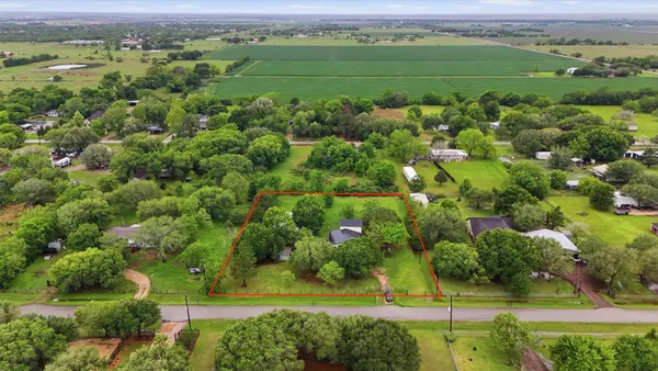 an aerial view of a golf course with a yard